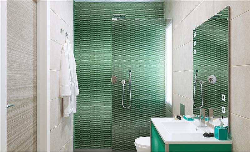Baño moderno con azulejos verdes